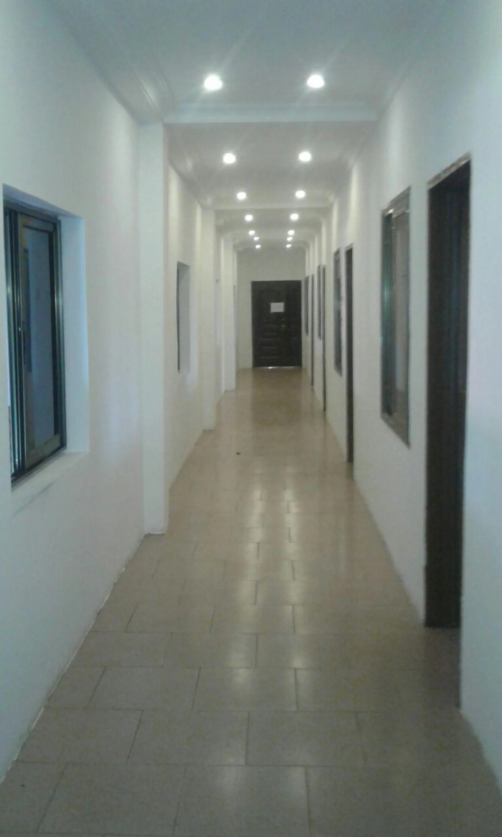 Clean, well-lit interior corridor inside the Oyarifa facility offices